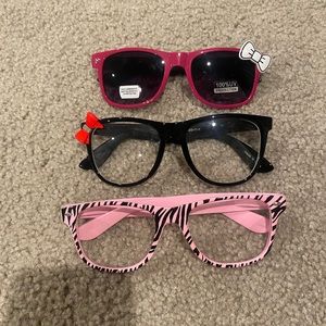 Three pairs of glasses (two clear; one tinted)